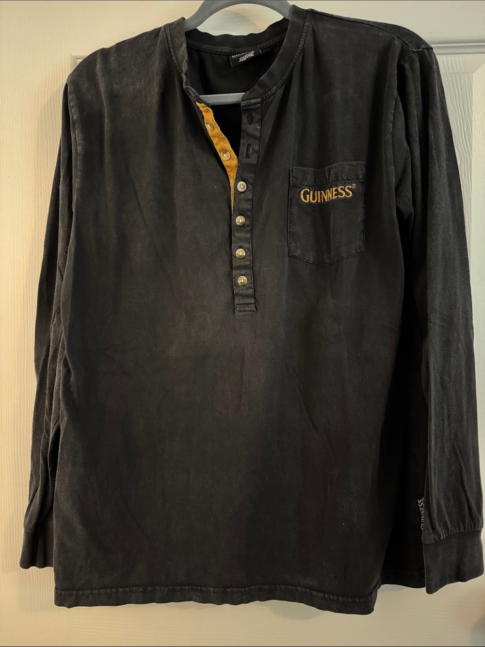 Guinness Black Long-Sleeve Henley with Gold Trim